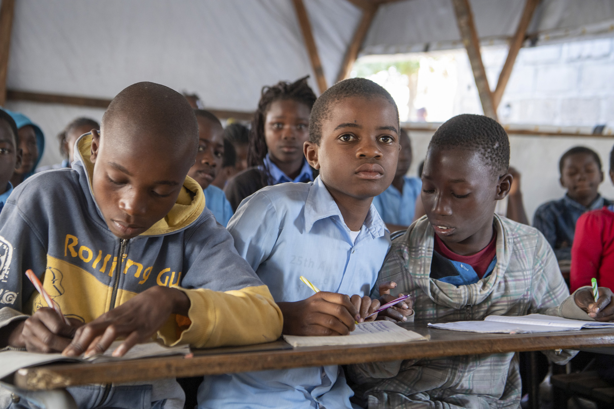 Students participate in a class at "25 de Junho" in Mozambique.